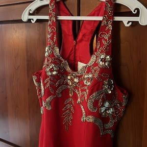 Never worn, red with gold beaded accent evening gown